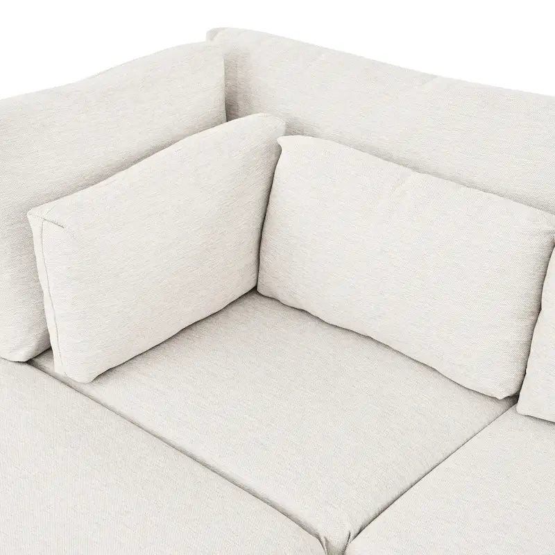 Divano sezionale a L beige con pouf, 4 posti a sedere